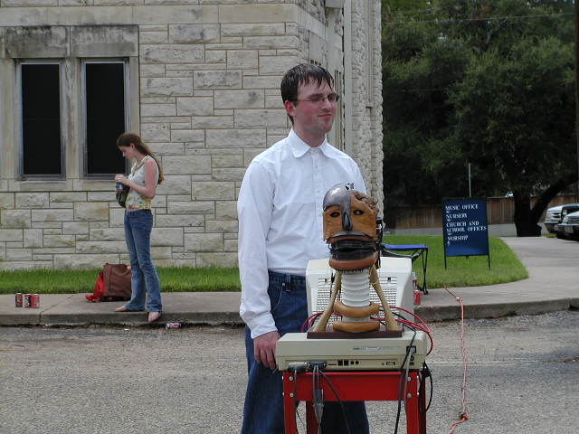 In the film, Armadillo News, Edmond, the evil genius, is seen with Babbling Head in its role as NewsBot