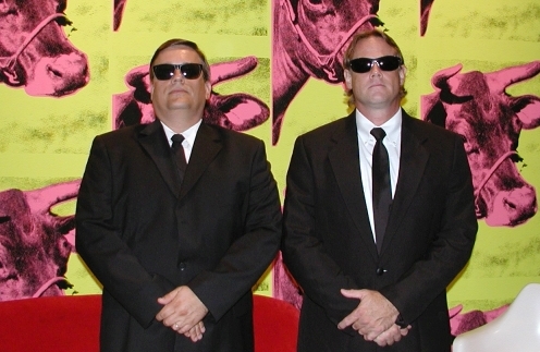 The grizzled Eric Ludquist and the dashing Glenn Currie as the mysterious Men in Black.