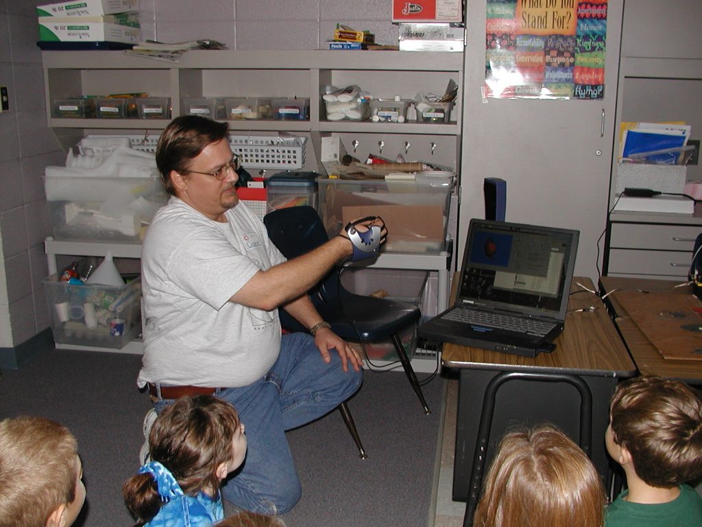 Eric Lundquist demonstrates the P5 Virtual Reality glove.