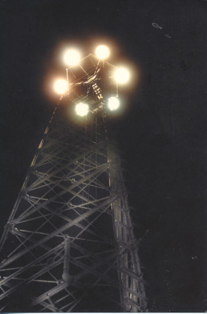 Front side of postcard with a photo (dated 2005) of one of Austin's Moonlight Towers looking up from ground-level.

Courtesy of Ross Miller and Austin Green Art.